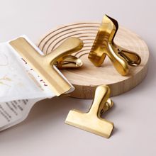 Product image of სამზარეულოს სარჭი/კლიპსი პატარა ოქროსფერი