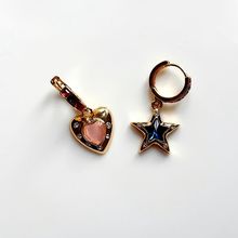 Product image of ოქროსფერი საყურე გულით და ვარსკვლავის თლებით